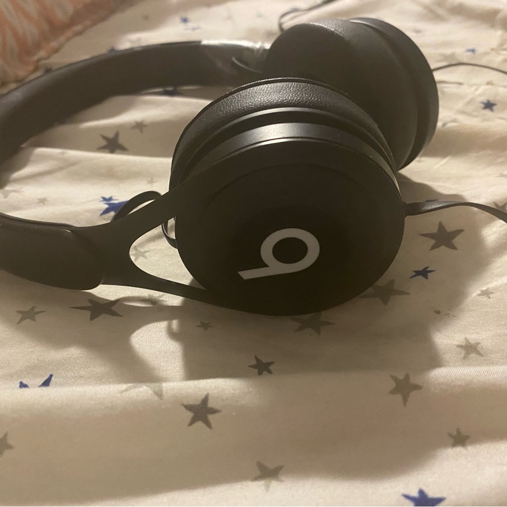 black beats with a wire and a microphone